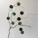 Emerald and mint honeycomb paper garland with gold edging and warm LED fairy lights