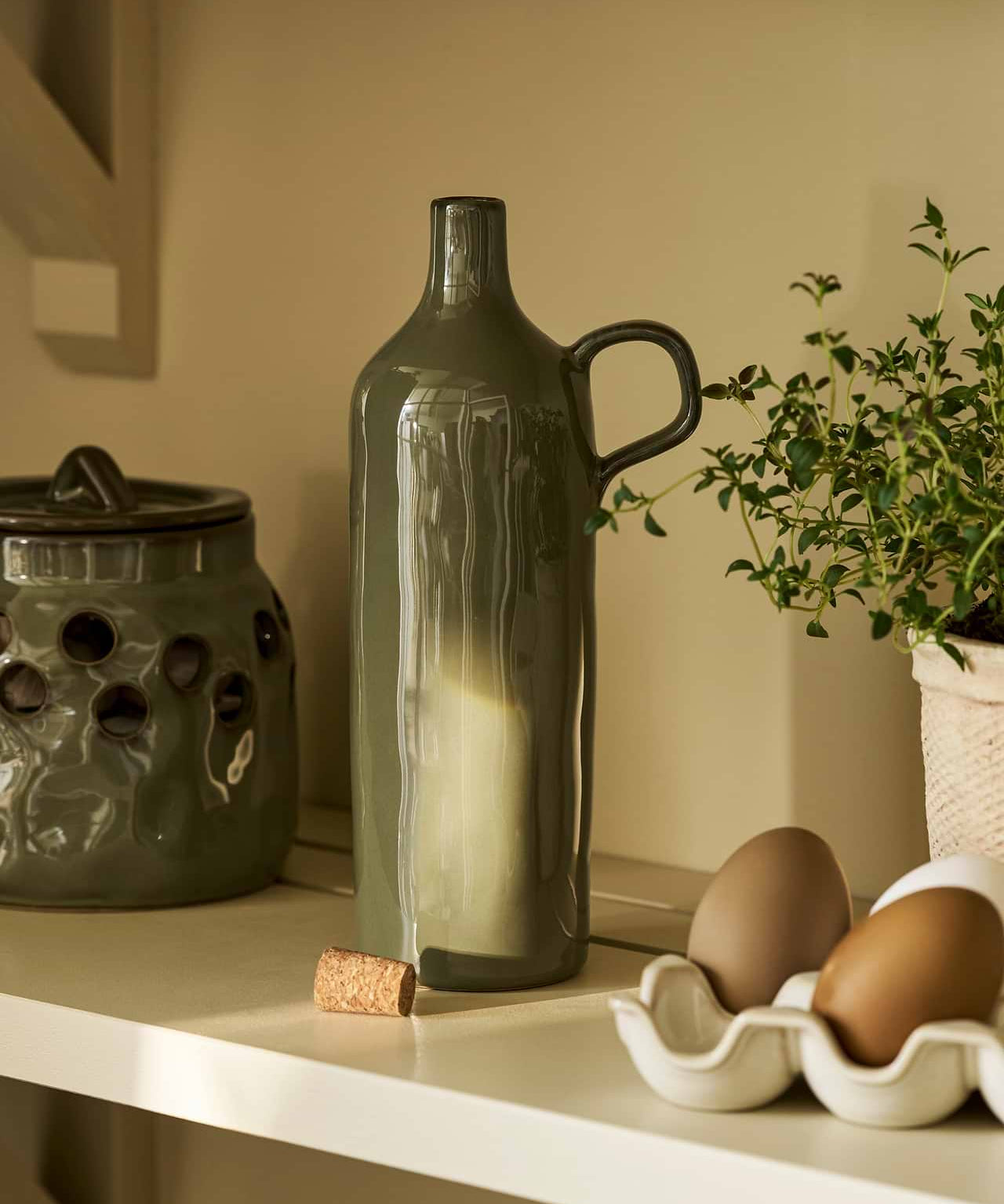 Moss green stoneware olive oil bottle with handle and natural cork stopper