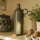 Moss green stoneware olive oil bottle with handle and natural cork stopper