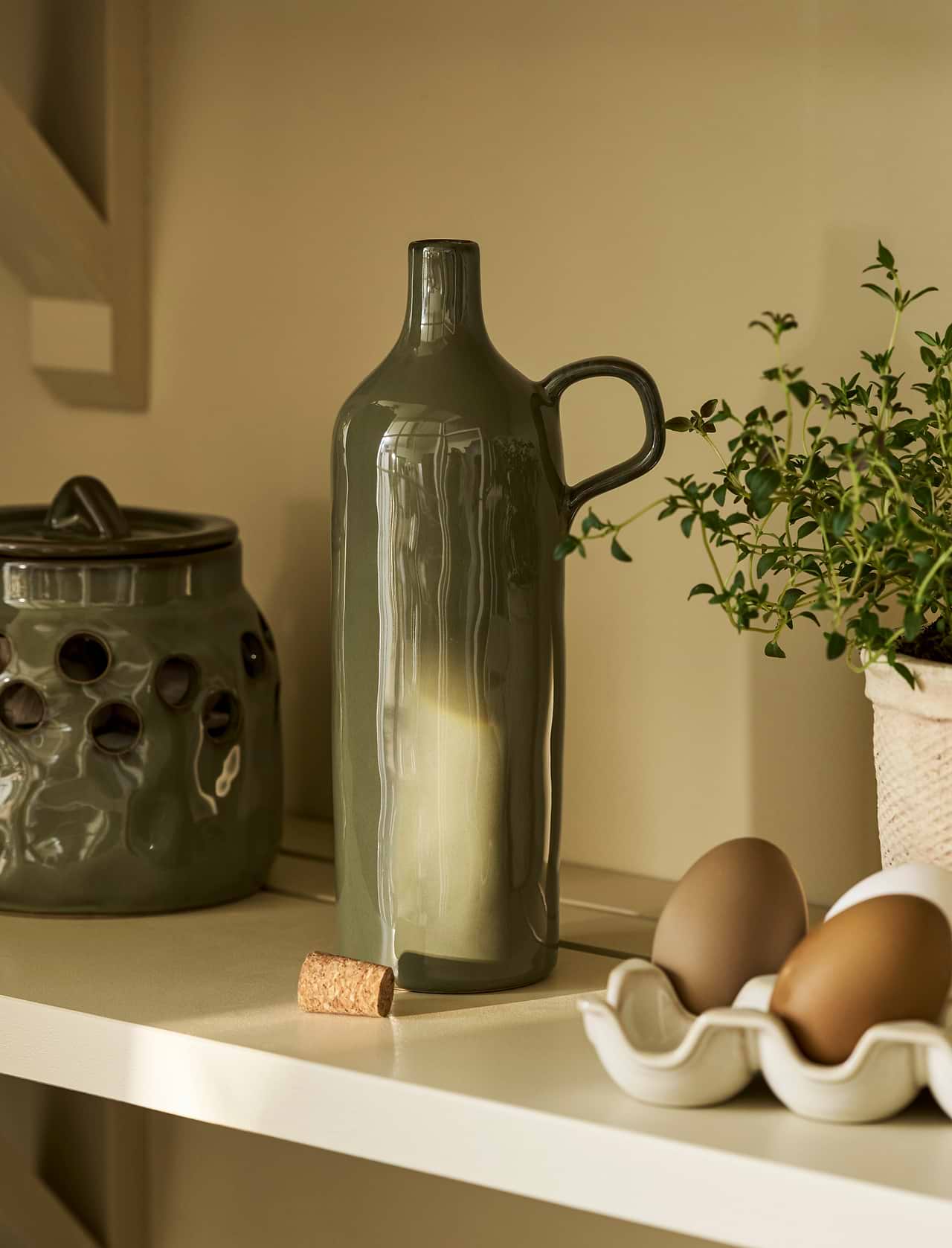 Moss green stoneware olive oil bottle with handle and natural cork stopper