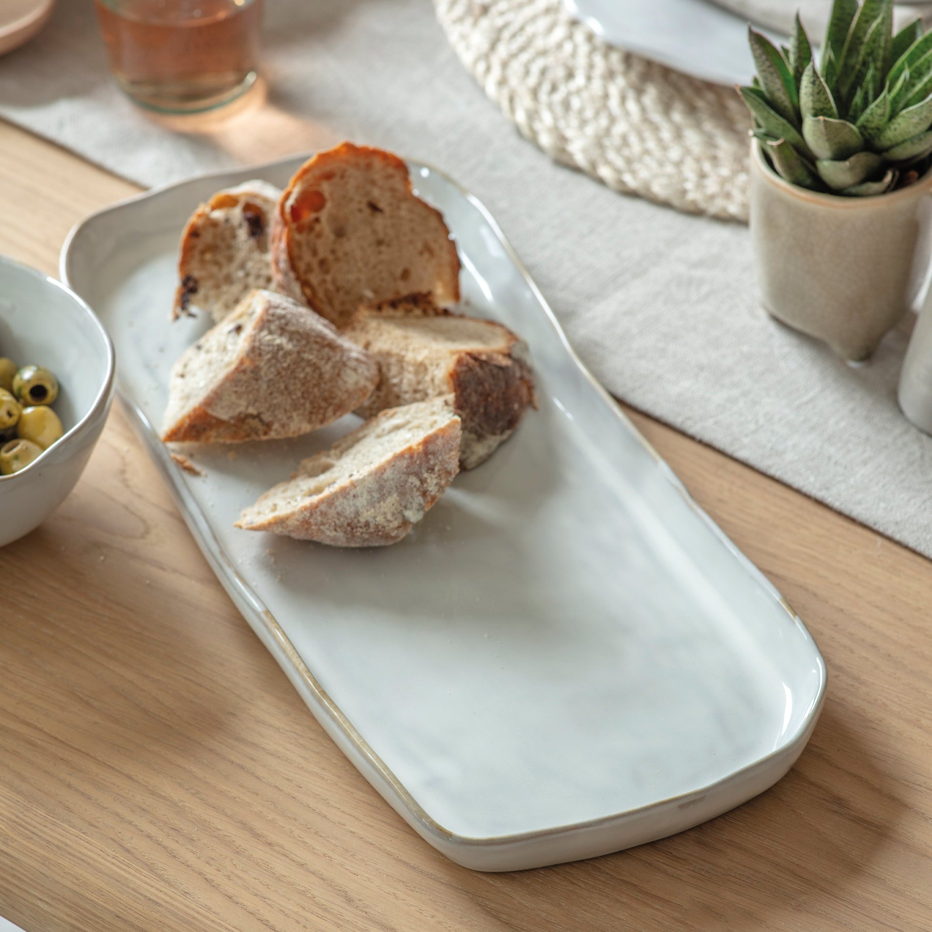 Ithaca white stoneware rectangular serving tray with softly curved edges and a natural glazed finish.
