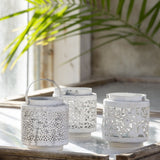 Ivory Jali Metal Lantern with decorative cutwork design for candlelight.