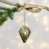 Large antique gold metal fir cone Christmas decoration with layered textured scales.