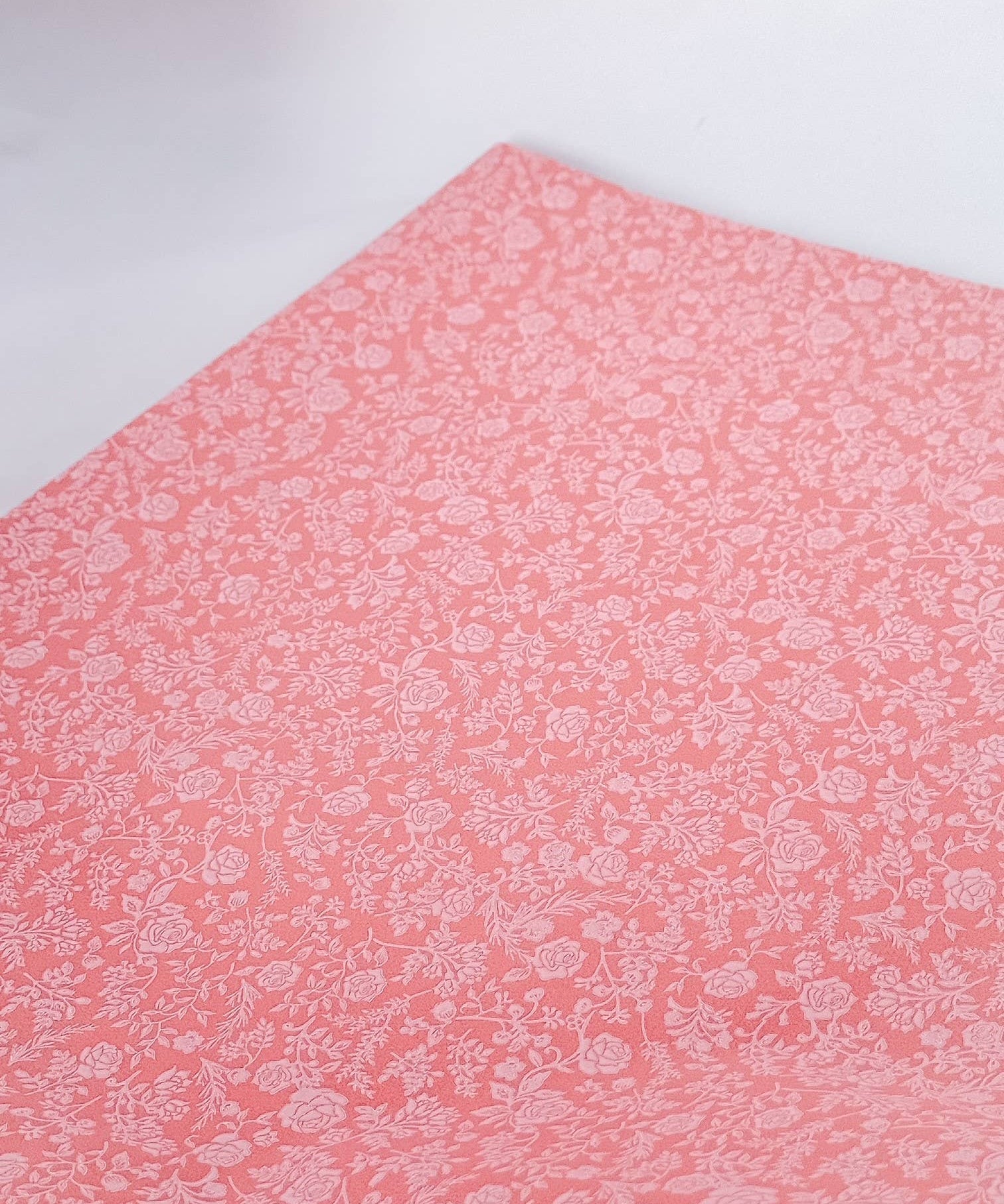 Liberty coral and white floral tissue paper sheet with a delicate printed design for luxury gift wrapping, 62 × 86cm.