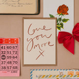 Love You More X handwritten greetings card with minimalist typographic design.