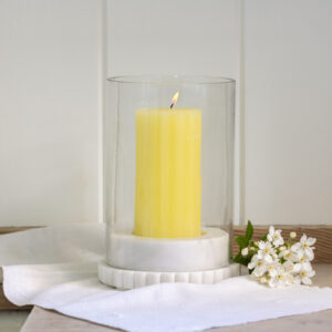 Elevate your home with the Makrana marble hurricane lamp. A glass cylinder on a natural marble base, perfect for pillar candles and warm, ambient lighting.