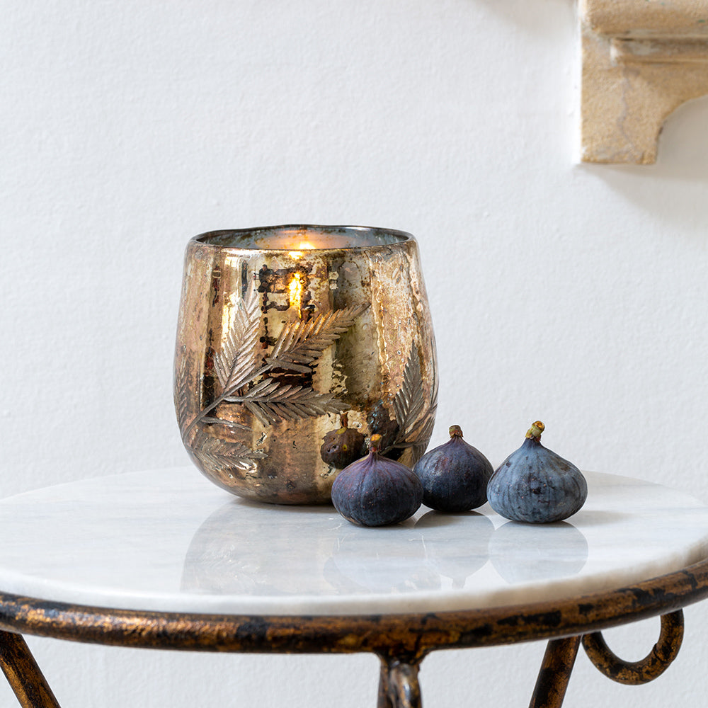 Elegant mercurised glass votive holder with etched fern detailing. A large silver candle holder perfect for ambient lighting, festive styling and tablescapes.