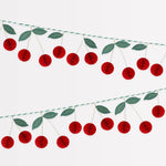 Shop the Meri Meri Cherry Honeycomb Garland with 3D paper cherries, green leaves and gold details. A reusable decoration for parties and summer tables.