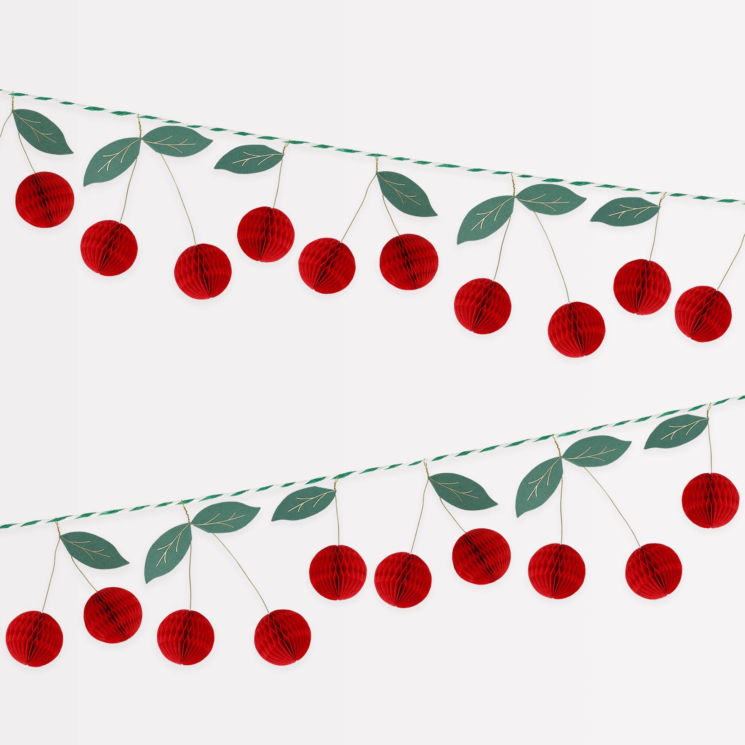 Shop the Meri Meri Cherry Honeycomb Garland with 3D paper cherries, green leaves and gold details. A reusable decoration for parties and summer tables.