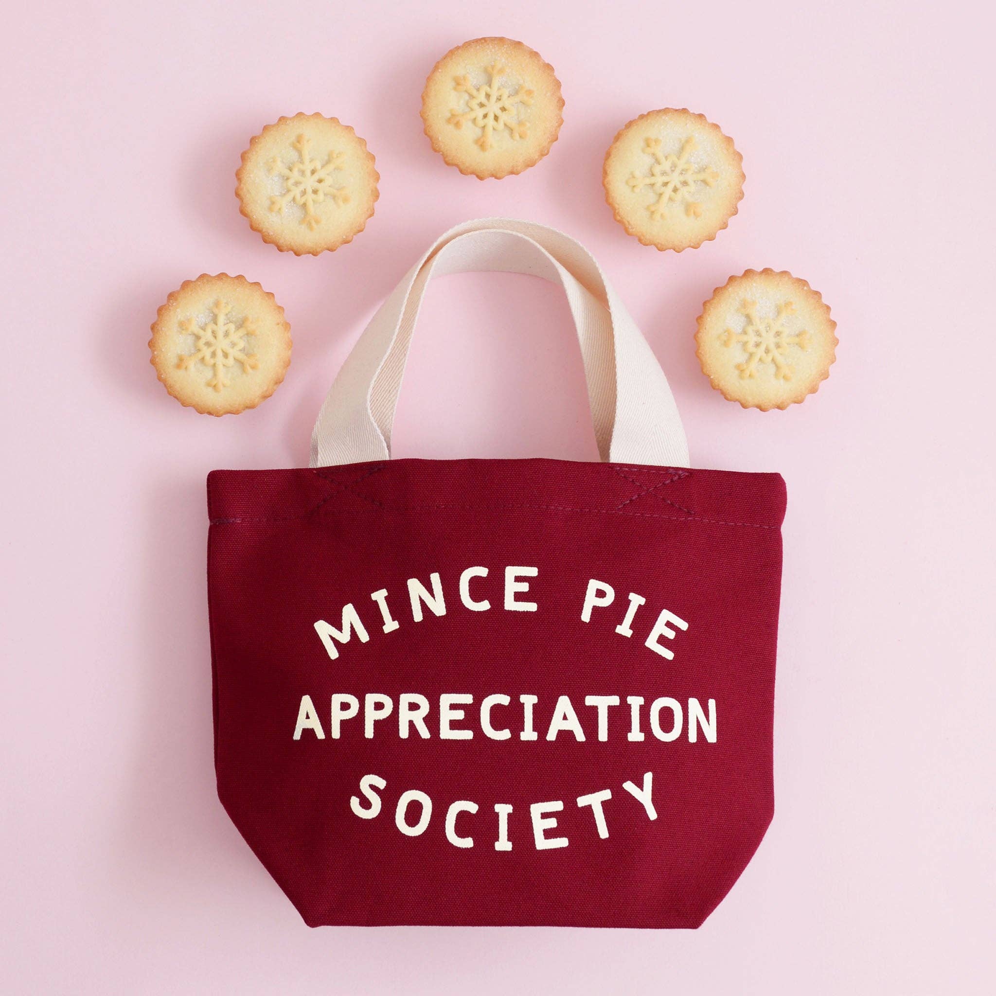 Mince Pie Appreciation Society mini canvas tote bag in burgundy with off-white lettering, perfect for Christmas gifts and festive treats.