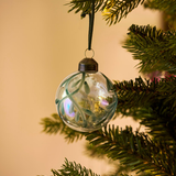Clear glass Christmas baubles with hand-painted green mistletoe design and dark green hanging loops