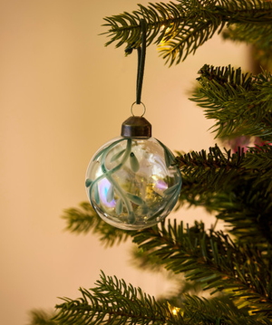 Clear glass Christmas baubles with hand-painted green mistletoe design and dark green hanging loops