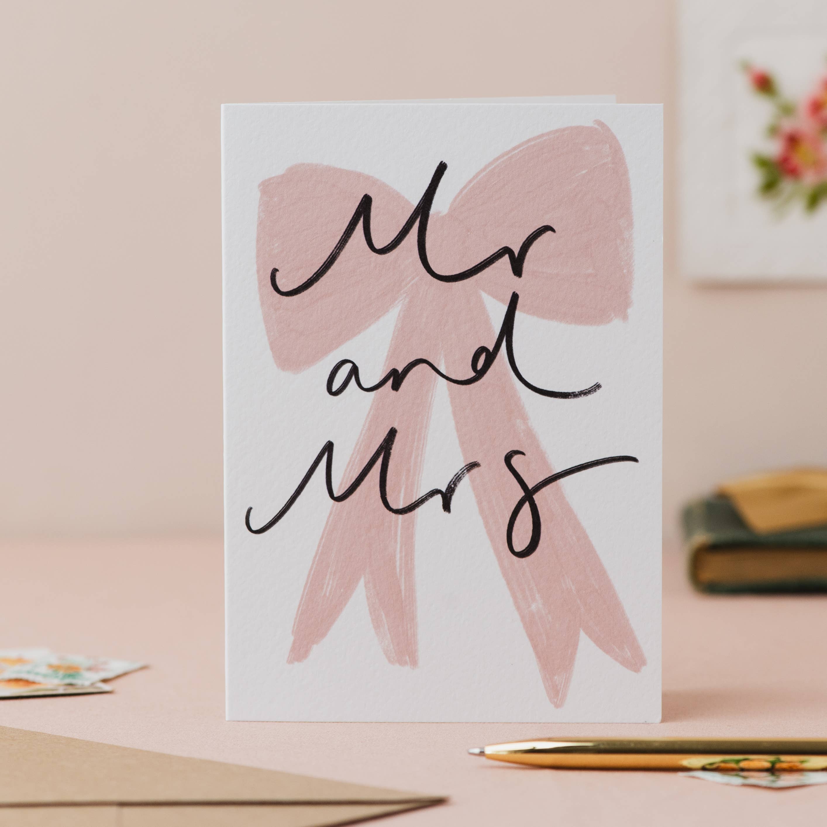 Mr and Mrs wedding card featuring an elegant bow and handwritten-style design.