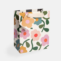 Medium multi floral gift bag featuring a colourful flower design with fabric handles and a matching gift tag.