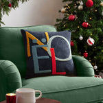 Multicoloured Noel Christmas cushion with embroidered tufted lettering