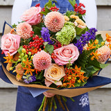 A colourful bouquet of dahlias, roses and complementing summer flowers.