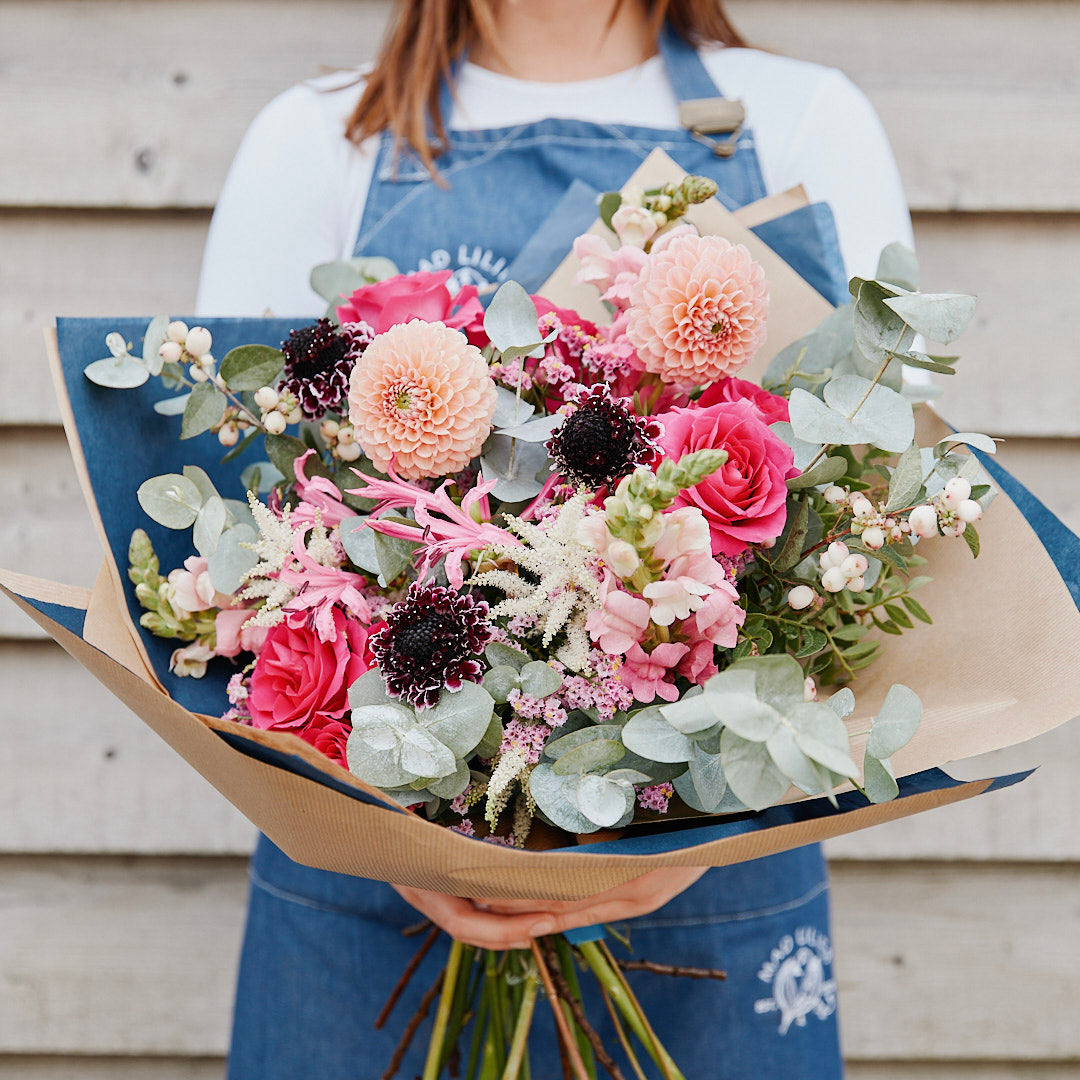 Bold, beautiful, and a little bit showy. Our Ooh La Dahlia Bouquet is a hand-tied, florist-designed display of fresh seasonal dahlias and flowers.