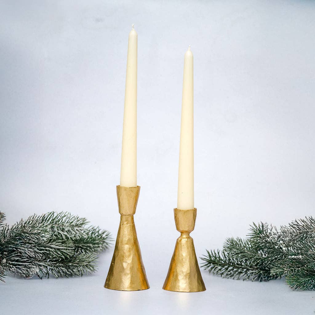 
Orla hand-forged gold metal candlestick holder for slim dinner candles, available in two sizes.