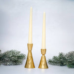 
Orla hand-forged gold metal candlestick holder for slim dinner candles, available in two sizes.