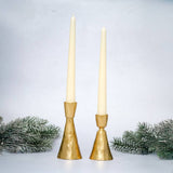 
Orla hand-forged gold metal candlestick holder for slim dinner candles, available in two sizes.