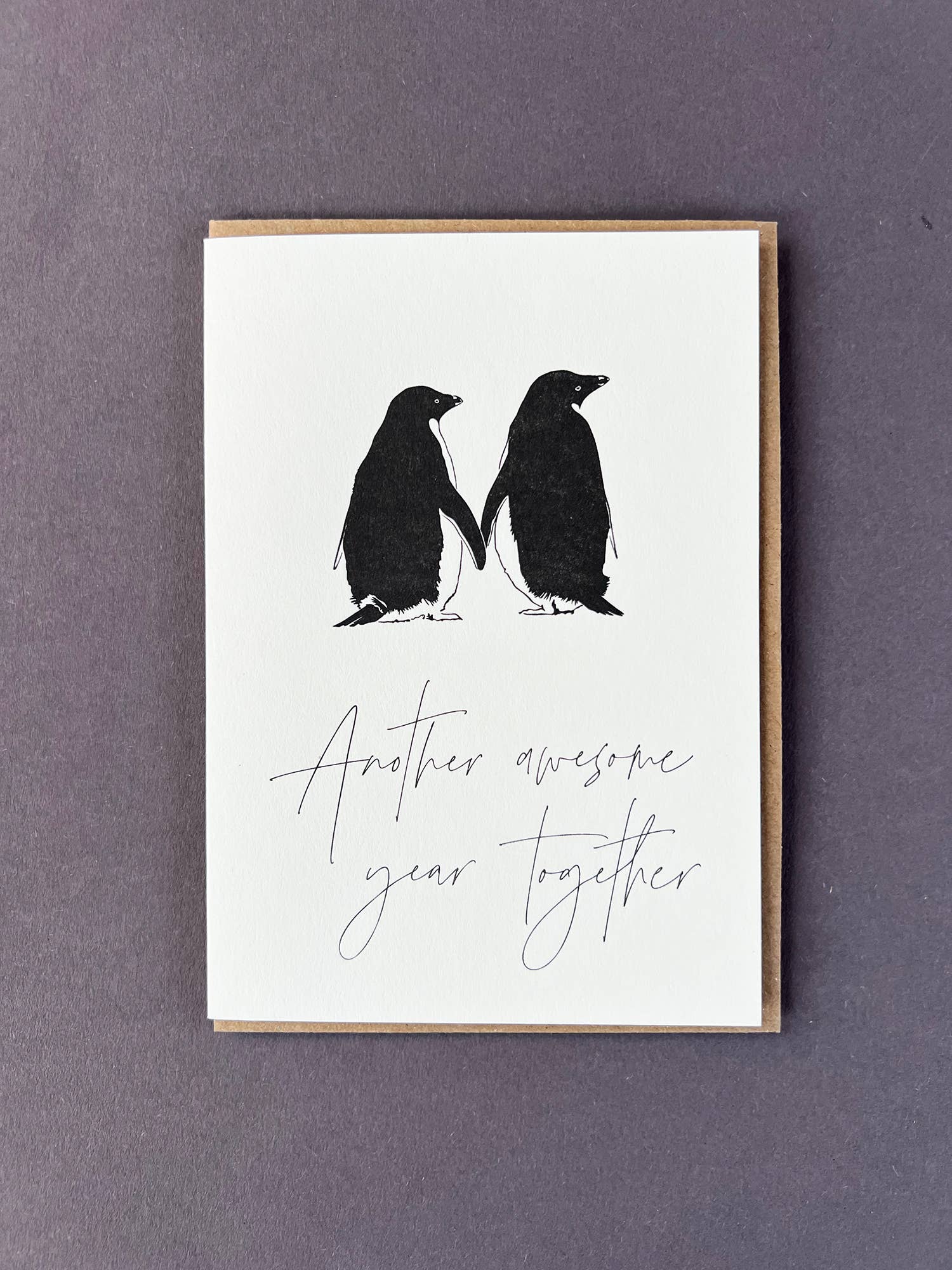 Celebrate love with the Another Awesome Year Together penguin letterpress card by Penguin Ink. Printed on 100% recycled board with a tactile embossed finish.