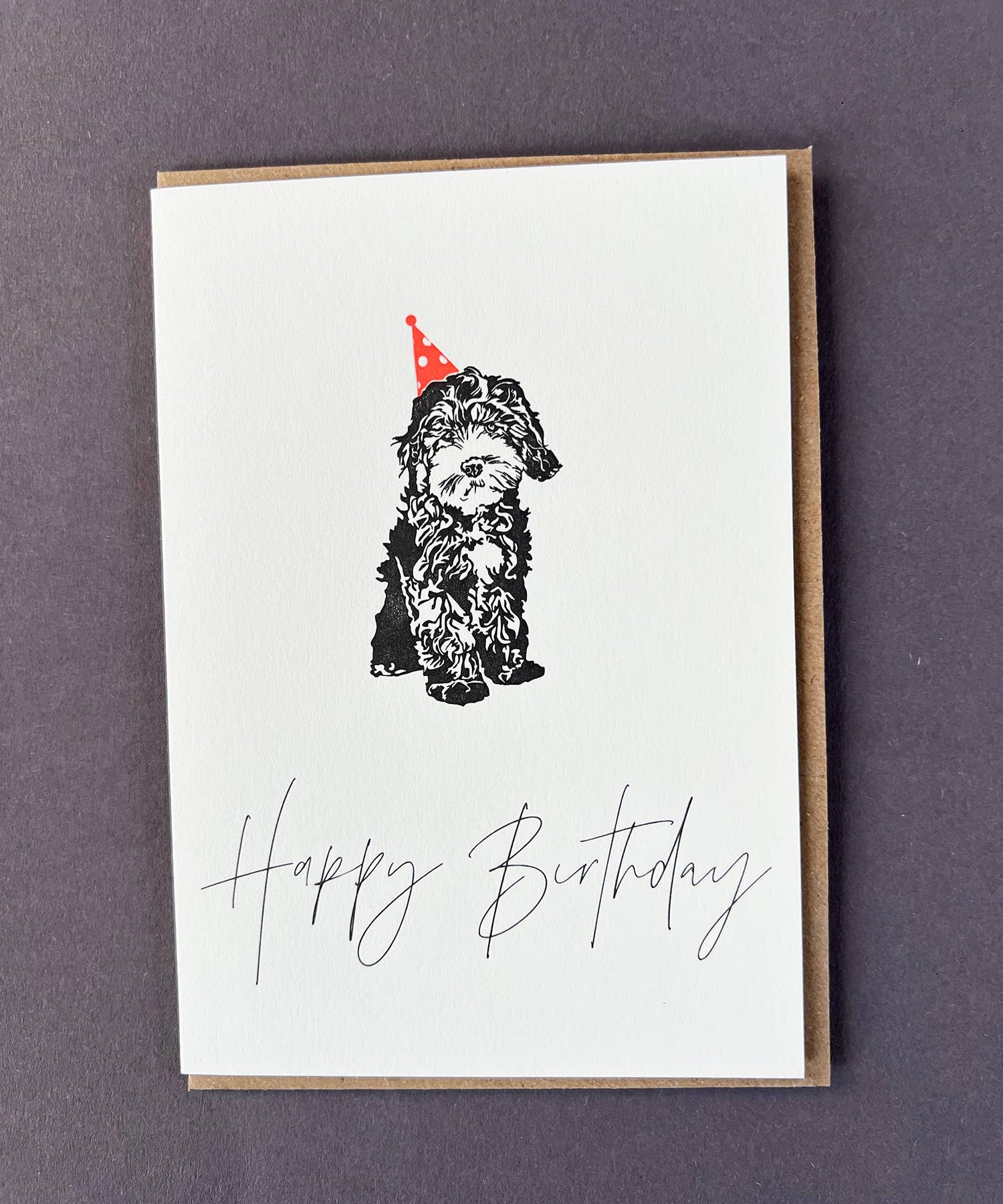 Penguin Ink Dog Birthday CardCelebrate any dog lover with this Happy Birthday Cockapoo letterpress card by Penguin Ink. Printed on 100% recycled board with a tactile embossed finish.