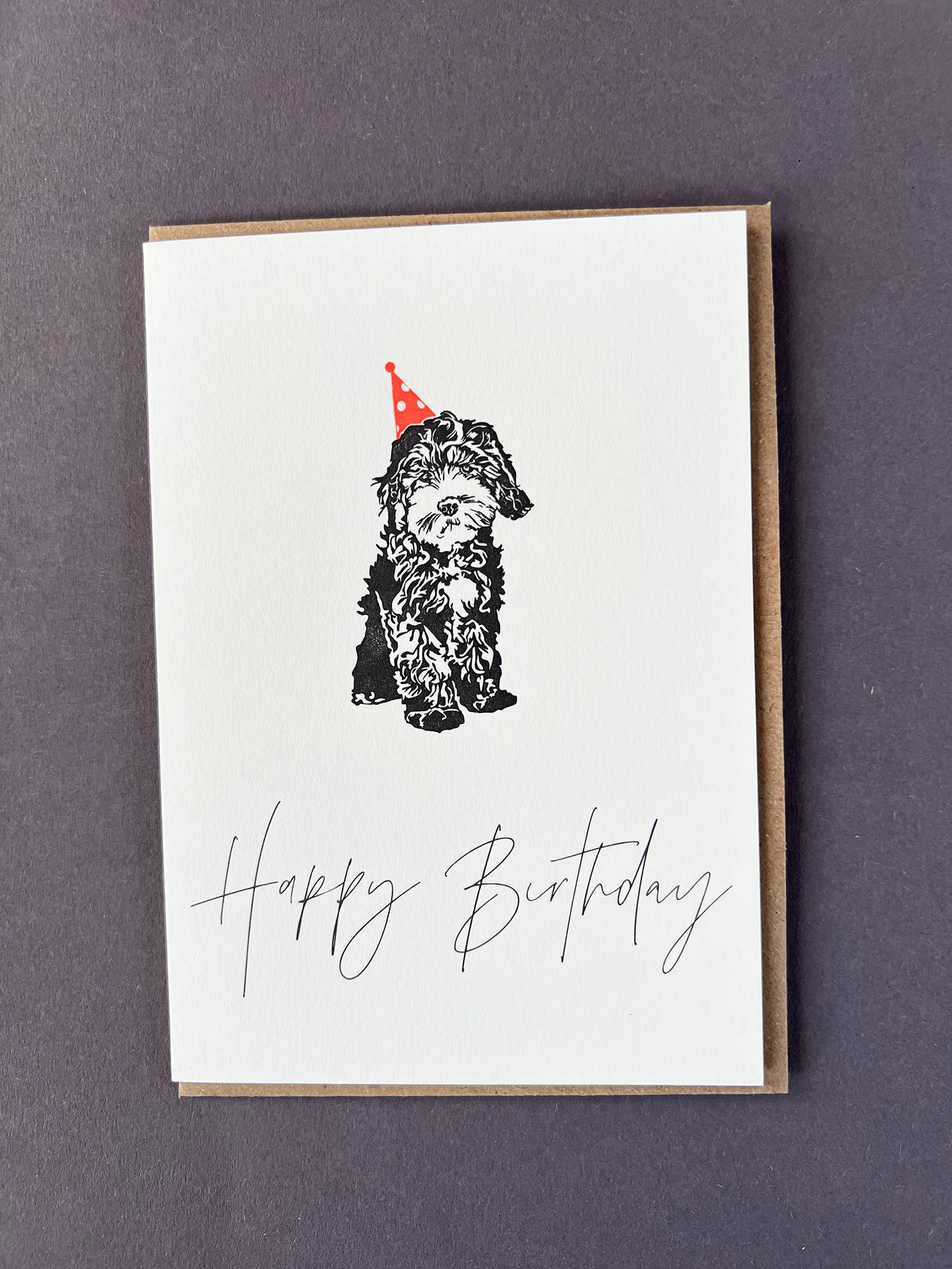Penguin Ink Dog Birthday CardCelebrate any dog lover with this Happy Birthday Cockapoo letterpress card by Penguin Ink. Printed on 100% recycled board with a tactile embossed finish.
