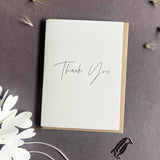 Penguin Ink mini Thank You letterpress greeting card featuring elegant black modern calligraphy printed on thick recycled card.