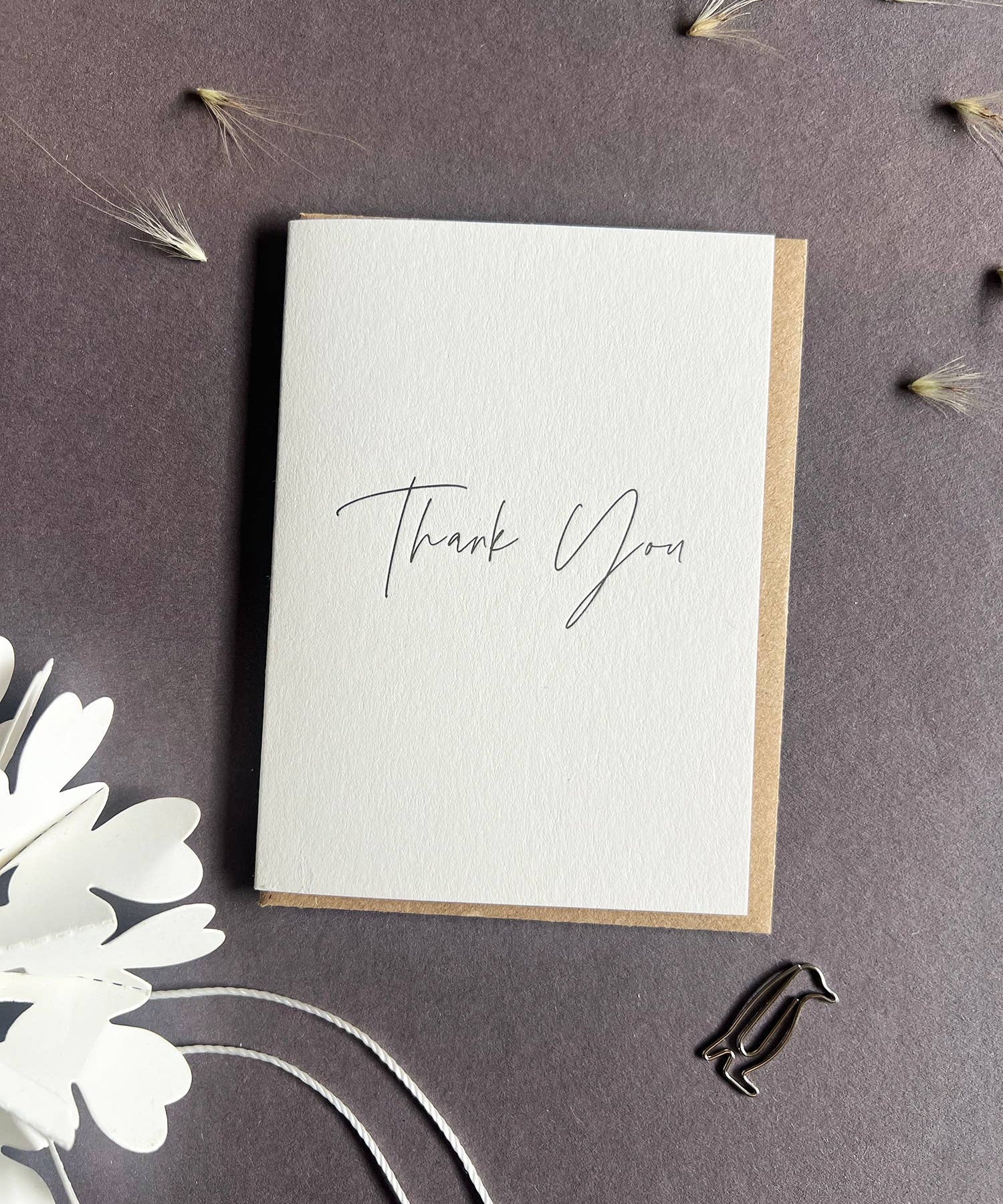 Penguin Ink mini Thank You letterpress greeting card featuring elegant black modern calligraphy printed on thick recycled card.