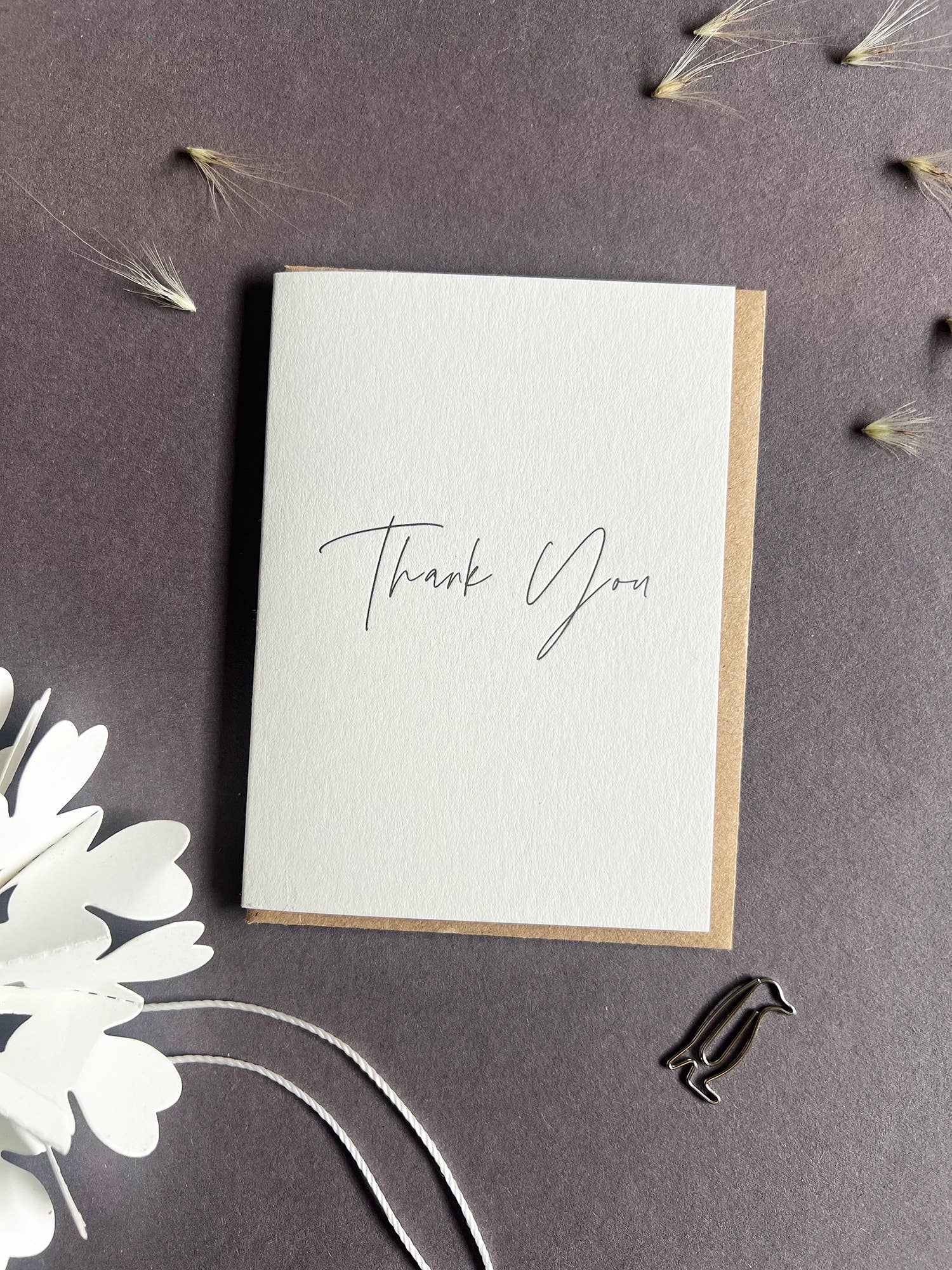 Penguin Ink mini Thank You letterpress greeting card featuring elegant black modern calligraphy printed on thick recycled card.