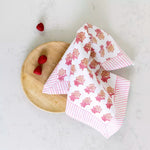 Elegant hand block print cotton napkins in soft peony pink with floral detailing and striped border. Perfect for tablescapes, entertaining and everyday dining.