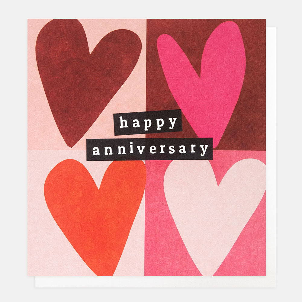 Happy Anniversary card featuring four pink and red love hearts in a block grid design with gold foil detailing.