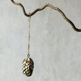 Pistachio green pinecone Christmas tree decoration with Nordic woodland styling
