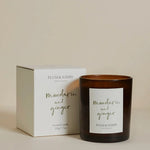 Plum & Ashby Mandarin and Ginger candle with packaging on a beige background