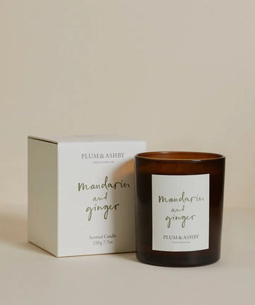 Plum & Ashby Mandarin and Ginger candle with packaging on a beige background