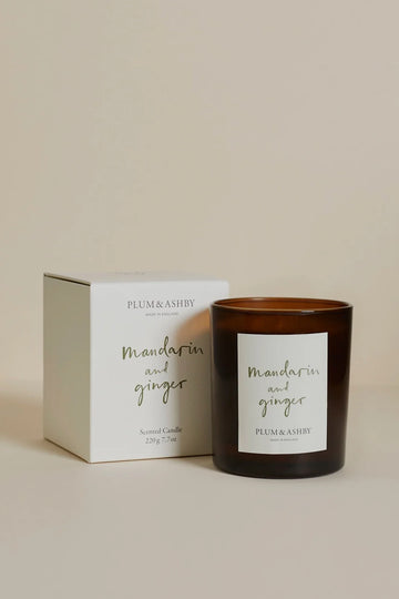 Plum & Ashby Mandarin and Ginger candle with packaging on a beige background