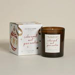 Plum & Ashby Cedarwood & Pine Needles 220g Christmas scented soy candle in a recyclable glass vessel with illustrated festive gift box.