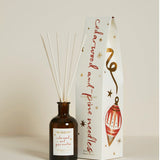 Plum & Ashby Cedarwood & Pine Needles 100ml Christmas reed diffuser in a recyclable glass vessel with illustrated festive gift packaging.