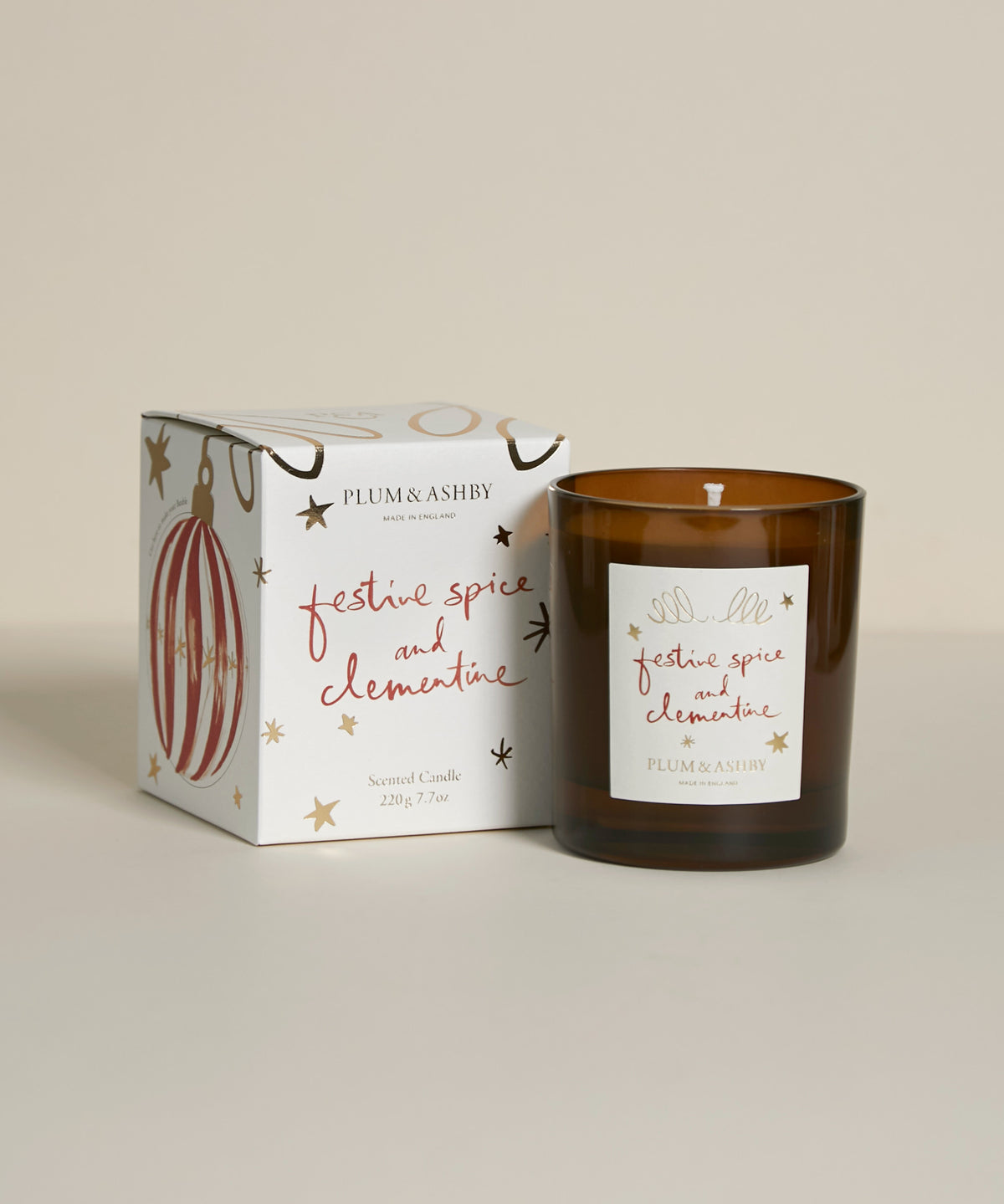 lum & Ashby Festive Spice & Clementine Christmas scented candle with illustrated festive gift packaging featuring reusable Christmas bauble decorations.