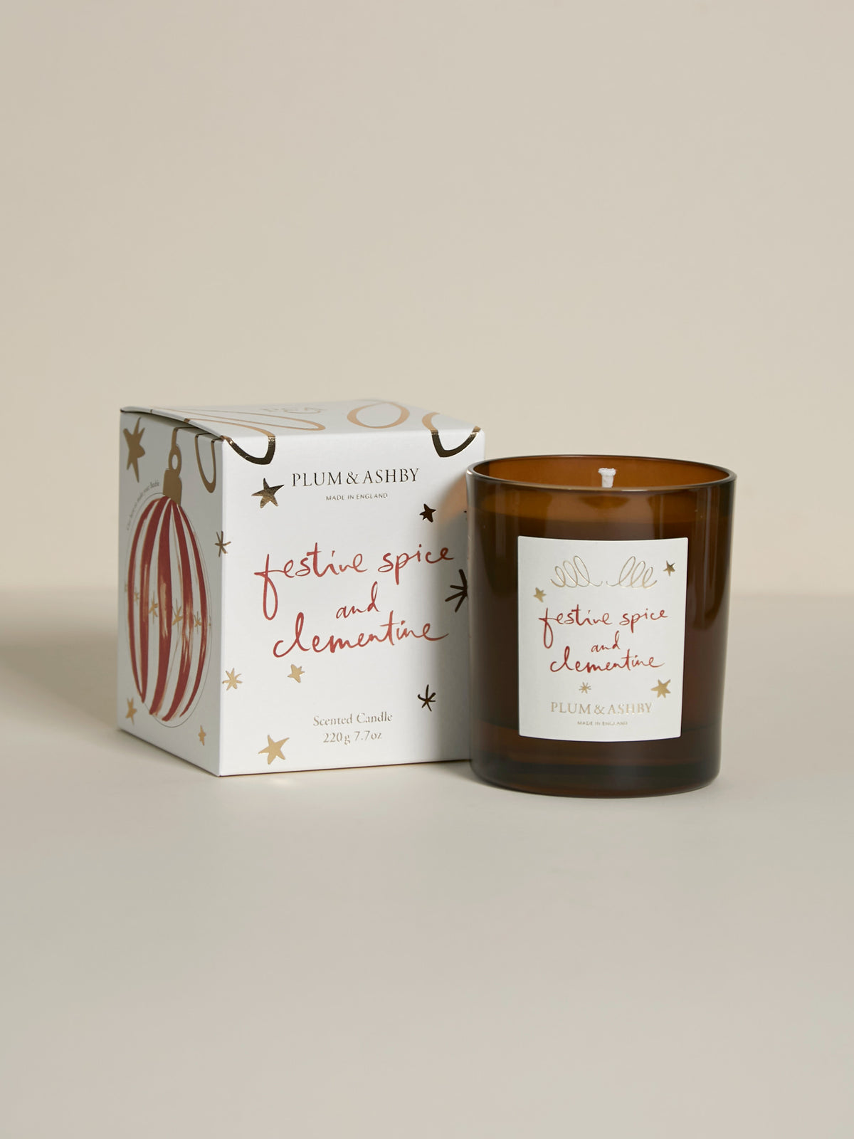lum & Ashby Festive Spice & Clementine Christmas scented candle with illustrated festive gift packaging featuring reusable Christmas bauble decorations.