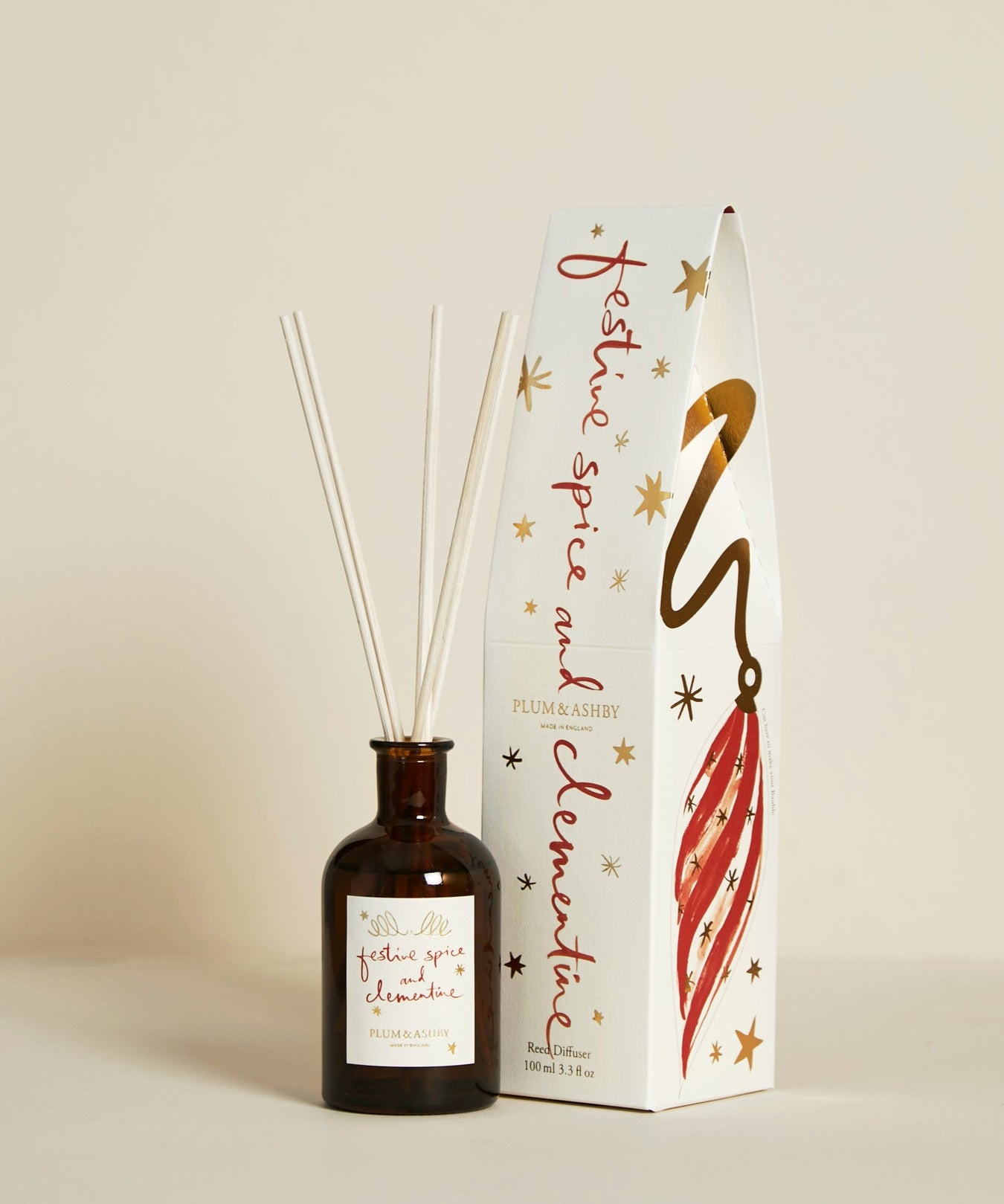 Plum & Ashby Festive Spice & Clementine Christmas reed diffuser with illustrated festive gift box featuring reusable Christmas bauble decorations.
