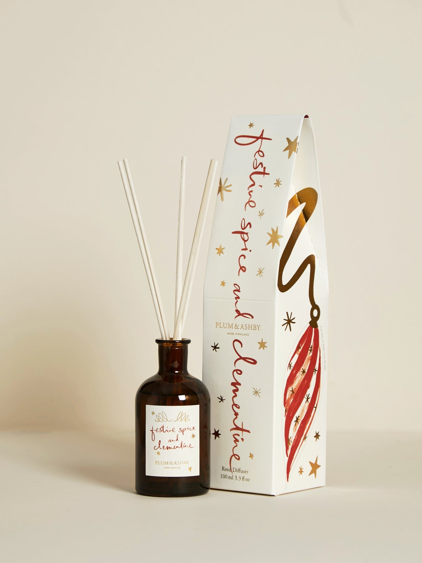 Plum & Ashby Festive Spice & Clementine Christmas reed diffuser with illustrated festive gift box featuring reusable Christmas bauble decorations.