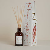 Fir Balsam & Winter Berries Reed Diffuser in a recyclable glass bottle with natural reeds. A luxury Christmas home fragrance with fir needle, winter berries, cinnamon, cedarwood and amber, offering continuous festive scent for up to 8 weeks.