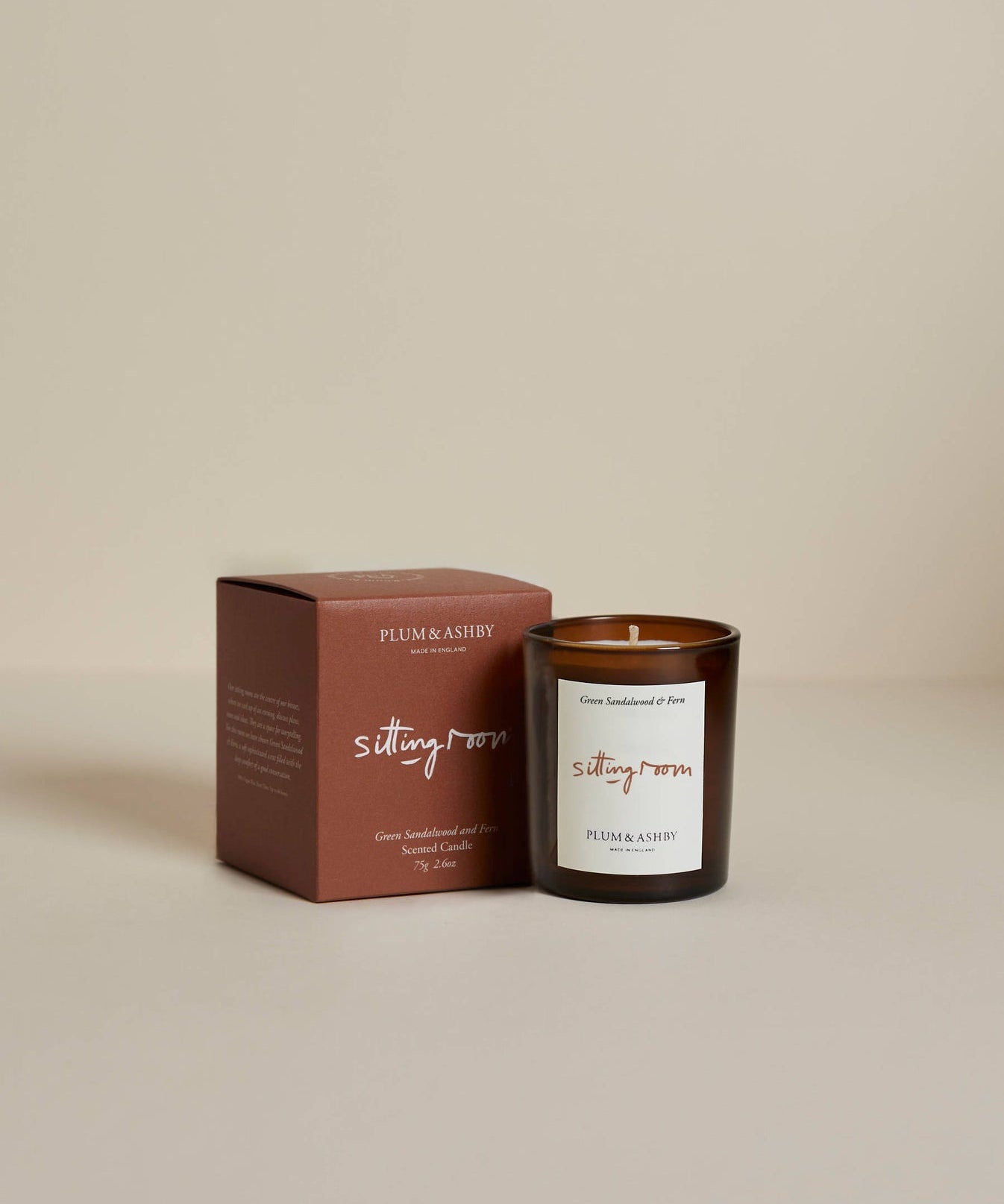 Plum & Ashby Sitting Room Votive Candle – Green Sandalwood & Fern in a recyclable glass vessel. A hand-poured natural soy wax candle with fresh violet leaf, lily of the valley, green sandalwood, vetiver and fern, designed to create a warm, calming living space.