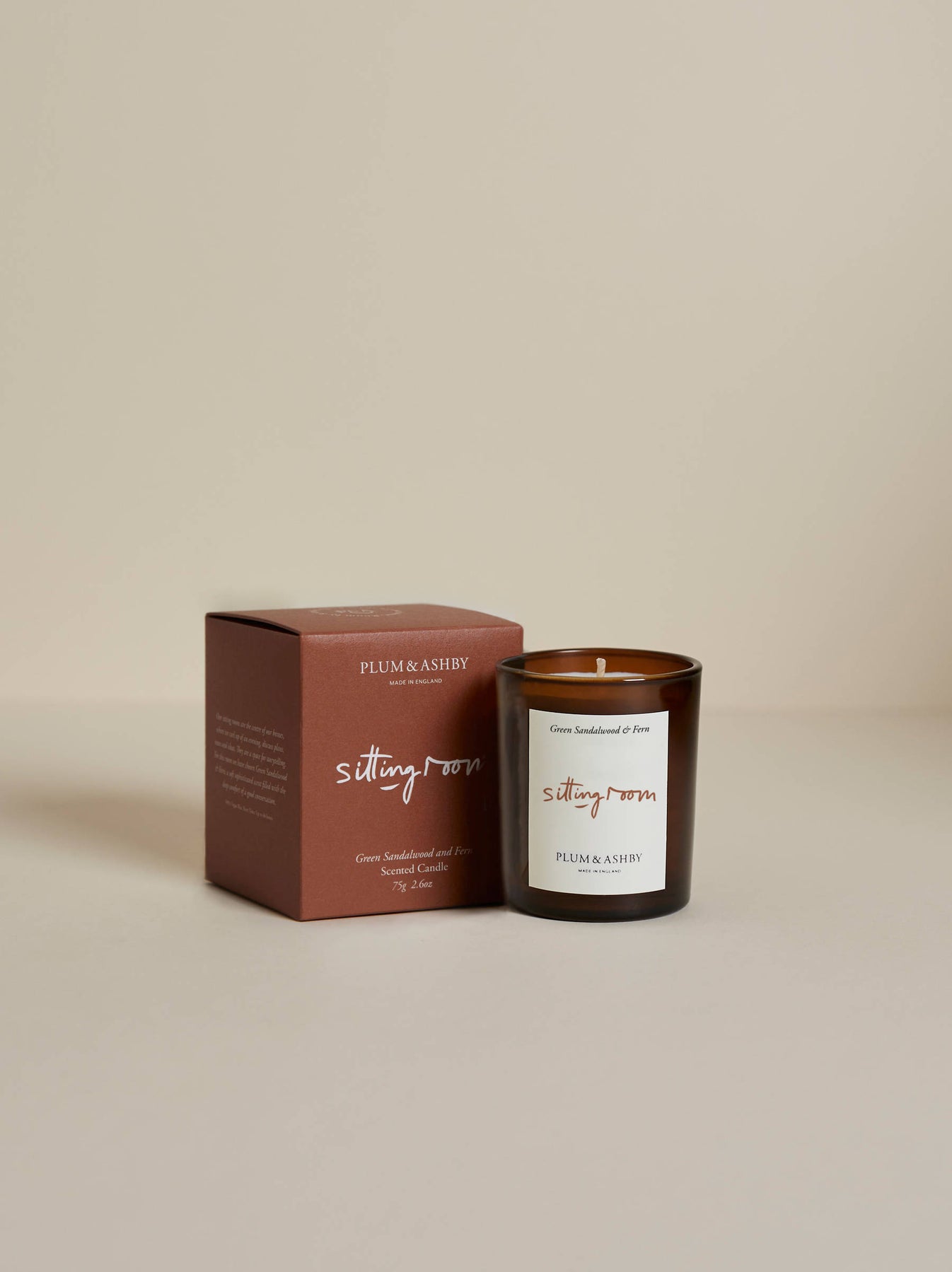 Plum & Ashby Sitting Room Votive Candle – Green Sandalwood & Fern in a recyclable glass vessel. A hand-poured natural soy wax candle with fresh violet leaf, lily of the valley, green sandalwood, vetiver and fern, designed to create a warm, calming living space.