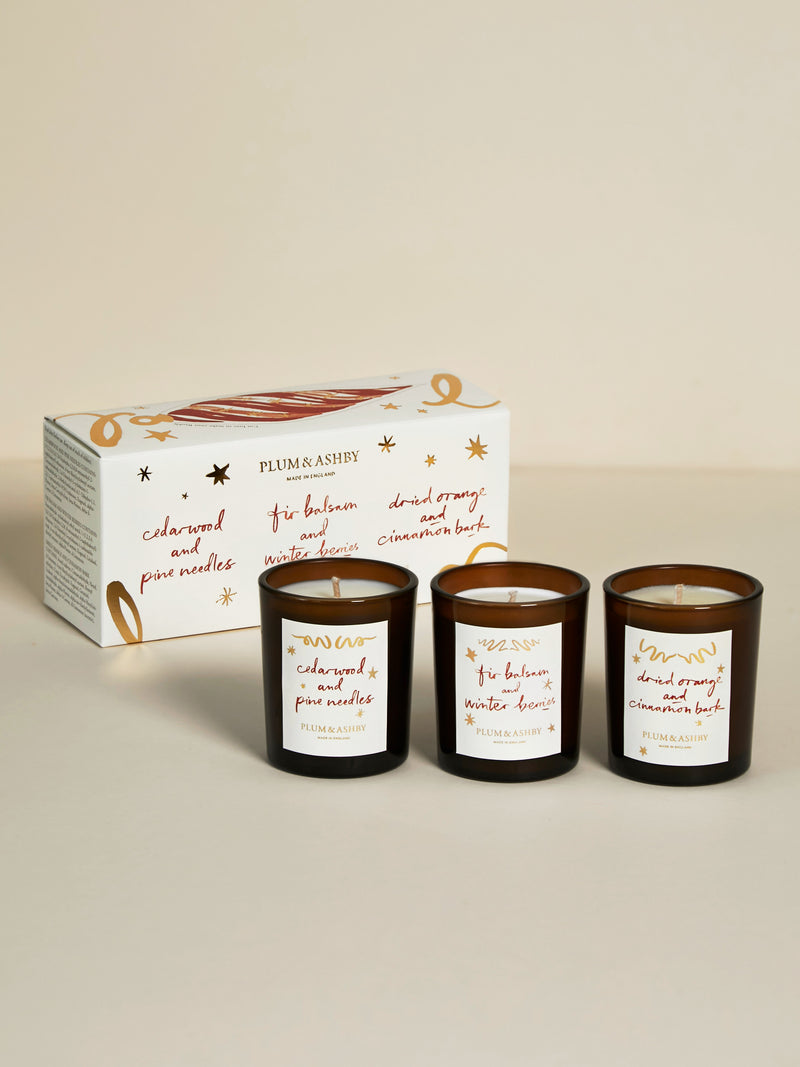 Plum & Ashby Winter Candle Gift Set with three festive votive candles in an illustrated Christmas gift box.