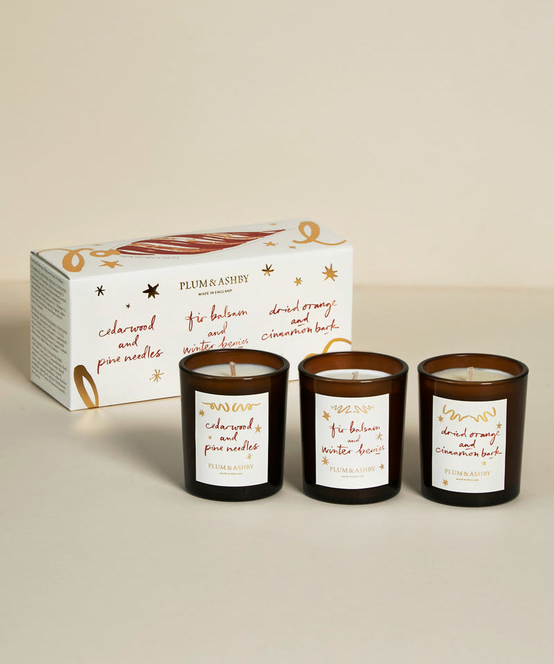 Plum & Ashby Winter Candle Gift Set with three festive votive candles in an illustrated Christmas gift box.