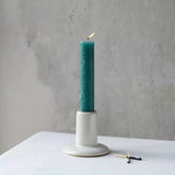 Elegant white ceramic candle holder with a textured finish and timeless cylindrical shape. Perfect for dinner candles, tablescapes and cosy interiors.