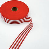 Red multistripe cotton ribbon featuring a striped design in complementary red tones, 35mm wide, ideal for gift wrapping and decorative bows.