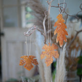 Rust effect hanging leaf decorations for autumn home styling